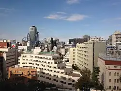 Buildings in Tokyo against a blue sky