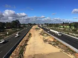 Earthworks within a highway median viewed from a bridge