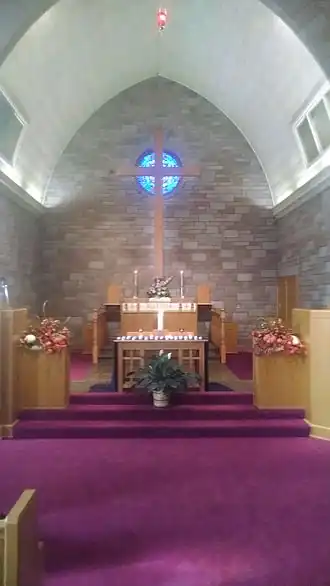 Votive candles lit for the faithful departed at a Congregationalist church for Totensonntag