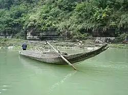 Traditional Miao Boat used to travel down rapids for trading goods.