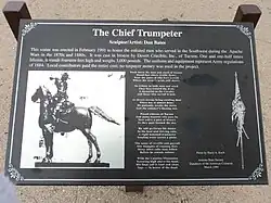 Information board detailing statue.