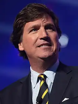 Tucker Carlson, right wing political commentator formerly employed by Fox News