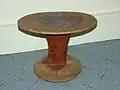 Wooden stool used by Turkana men. Carved from solid wood and conditioned with tobacco juice.
