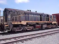 The 1811 was built for the U.S. Army by EMD. It is an EMD MRS-1 class locomotive that has adjustable gauge trucks to run in Europe and Russia. Now it belongs to the museum at Fort Eustis, but sits abandoned in Hanks Yard.
