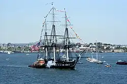 The USS Constitution fires a salute during its annual Fourth of July turnaround cruise.