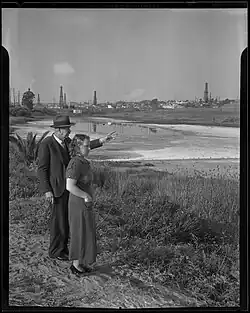 "T. J. Hoyt and Dorothy Evans look towards the salt Lake tract, proposed pleasure harbor site, Redondo Beach, 1935" (Los Angeles Times via UCLA Digital Collections)