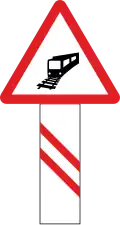 Unguarded railway crossing (200 metres ahead)