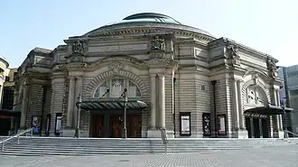 A modern photo of the exterior of the Usher Hall on a bright sunny day
