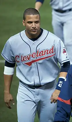 A man in a gray baseball uniform