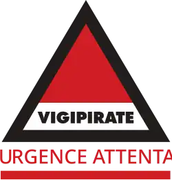 Vigipirate triangle with "Urgence Attentat" in red font