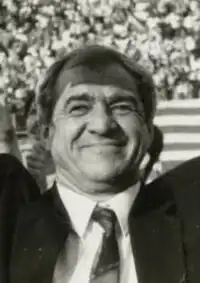 Viorel Hizo, holding up a prize check in 1994