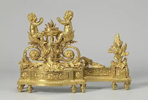 Firedog with putti that warm themselves at a flame; 1780–1790; gilt-bronze; height: 34.5&nbsp;cm; Rijksmuseum