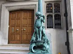 Another view of the bronze lamp standard on the right of the stairs.