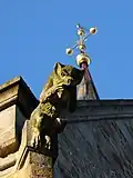 Gargoyle from Saint John's Church, Herford with the steeple ball in the background