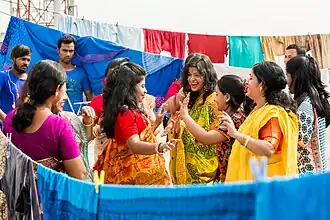 Girls are dancing in Bangladeshi gaye holud ceremony
