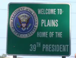 The Plains welcome sign, featuring the Seal of the president of the United States