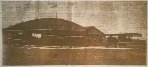 Old newspaper photo of an airport hangar