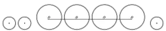 Diagram of two small leading wheels, four large driving wheels joined with a coupling rod, and a single small trailing wheel