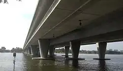 Long concrete bridge crossing a river