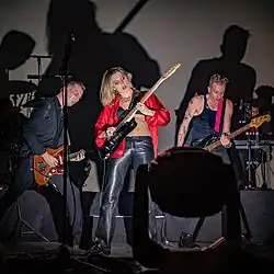 A band performs for a live audience.