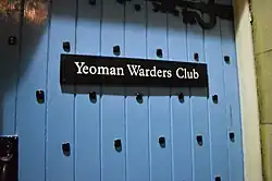 Blue door with text reading "Yeoman Waders Club"
