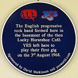 Both the speech bubble logo (left) and bubble logo (right) on the blue plaque where Yes was formed in the basement of the then Lucky Horseshoe Café in 1968.