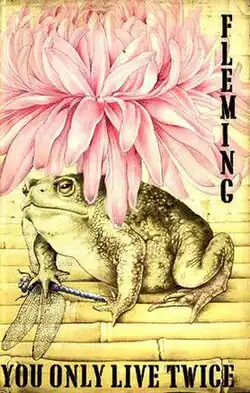 A pink chrysanthemum sits atop a toad who has trapped a dragonfly. In black capital letters are the words "Fleming" and "You Only Live Twice"
