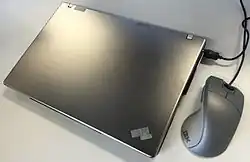 The ThinkPad Z61t accompanied by a silver ScrollPoint Pro