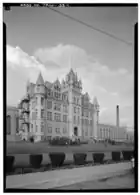 Large building behind a fence